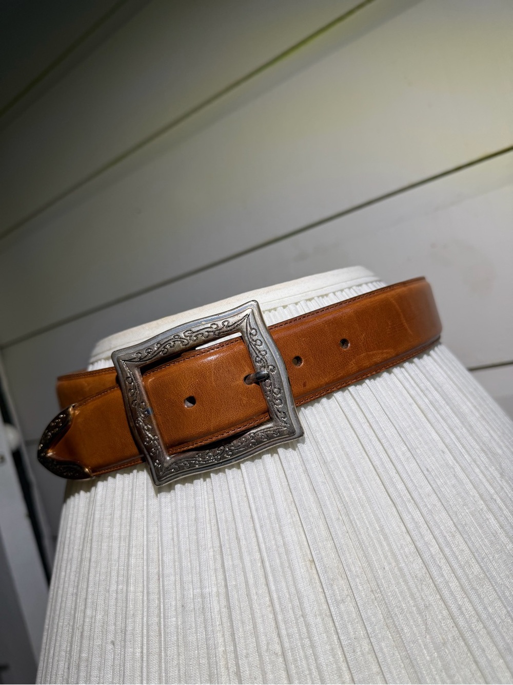 vintage Western-style leather belt featuring a detailed, buckle S